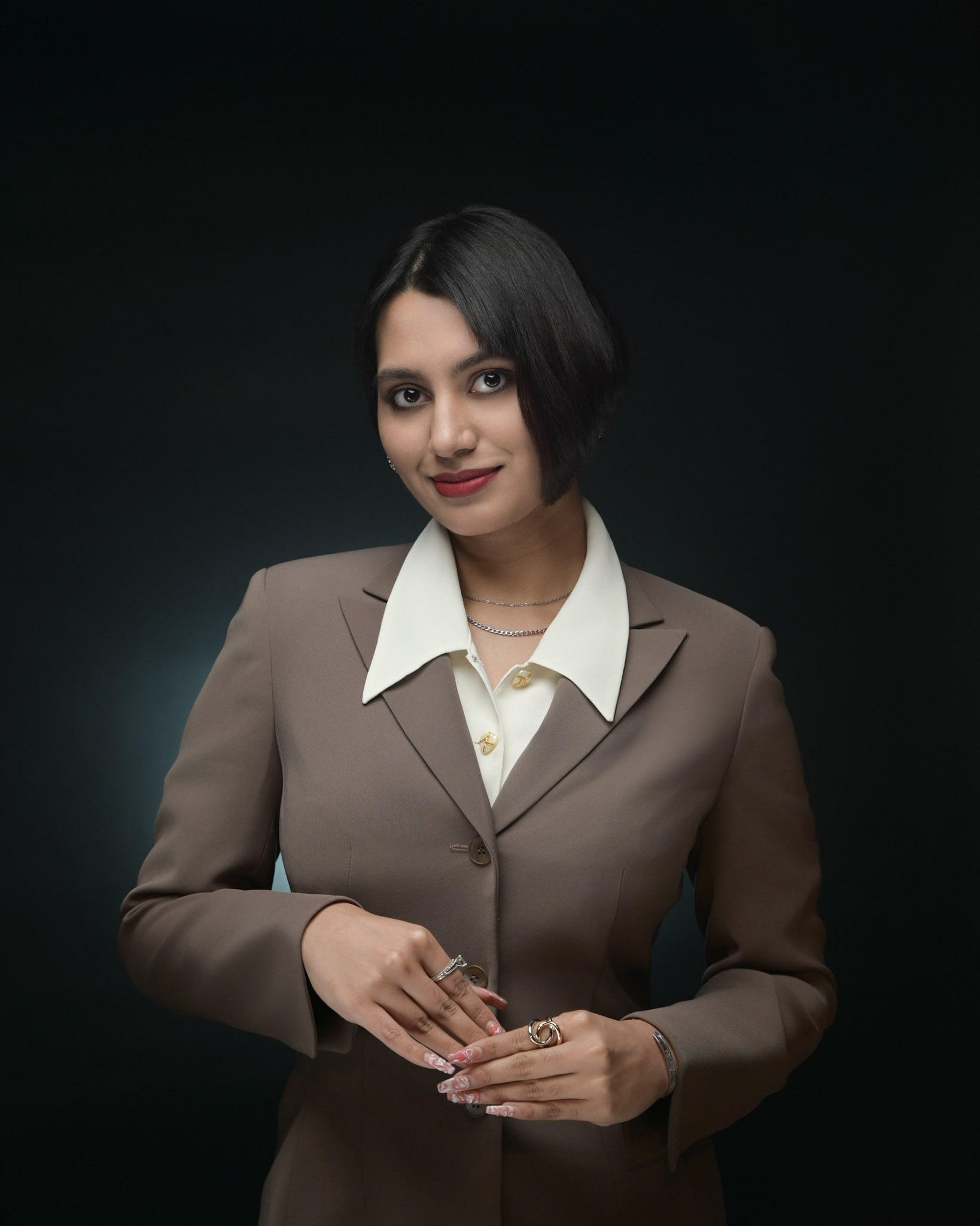 Professional headshot of woman in black blazer